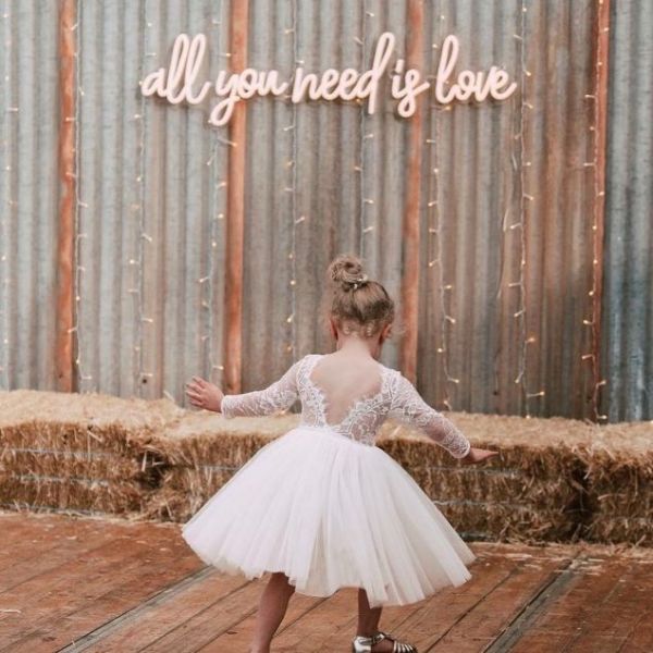 All You Need is Love neon sign with a pretty flower girl - from Custom Neon