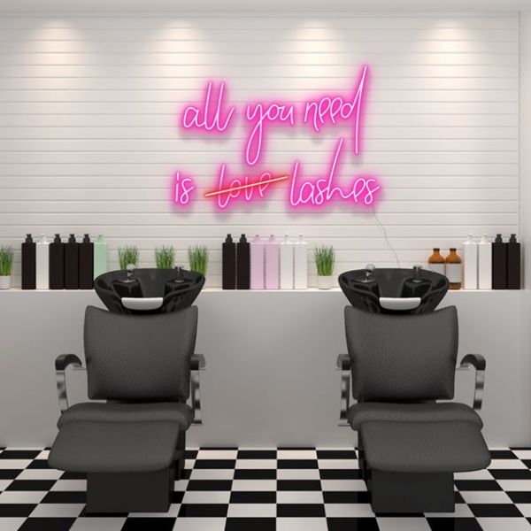 All You Need is Lashes faux neon sign shown in a beauty salon - from Custom Neon