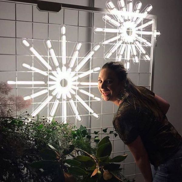 Christmas Star LED Neon Light shown on a frame with seasonal florals - photo from CustomNeon.com