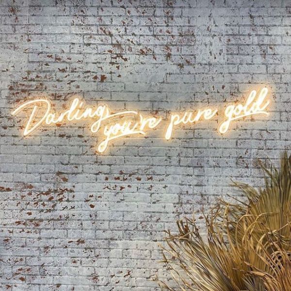 Darling, You're Pure Gold LED neon sign in warm white on distressed brick wall - from Custom Neon