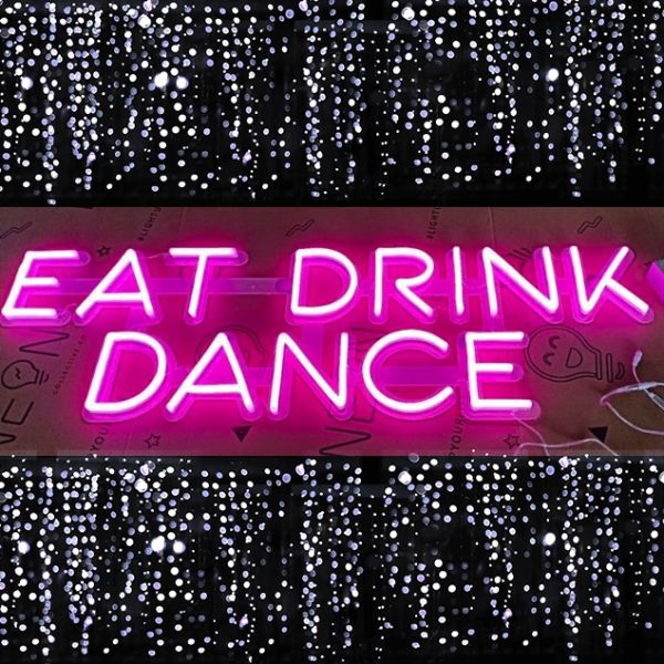 EAT DRINK DANCE playful pink LED neon sign - photo from CustomNeon.com
