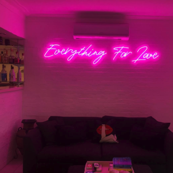 Everything For Love light sign in a living room - from Custom Neon
