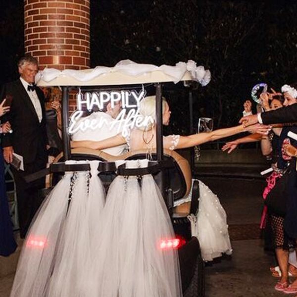 Happily Ever After portable neon sign with battery pack, shown attached to the bridal buggy - photo from Custom Neon (formerly Neon Collective)