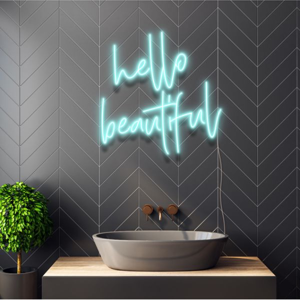 Hello Beautiful light sign in light blue above a bathroom sink - from Custom Neon