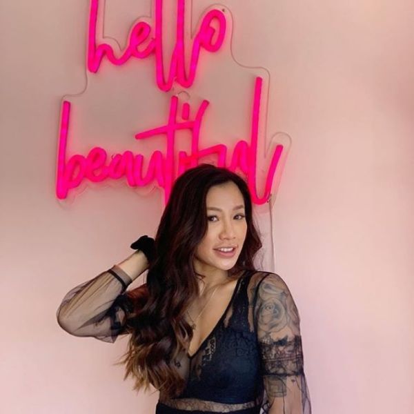 Hello Beautiful Faux Neon Sign on a photo wall at a beauty salon - photo Custom Neon