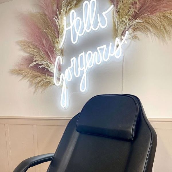 Hello Gorgeous white LED neon sign wall mounted in a salon - Custom Neon