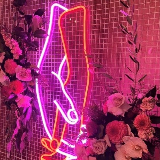 Holding hands in pink and red LED neon flex made by @customneon, styled for a wedding @thewarehousegeelong @theposieplace