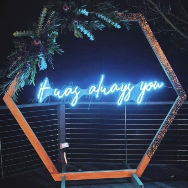 It Was Always You blue lightup wedding sign styled on wooden frame with indigenous floral arrangement - from @customneon