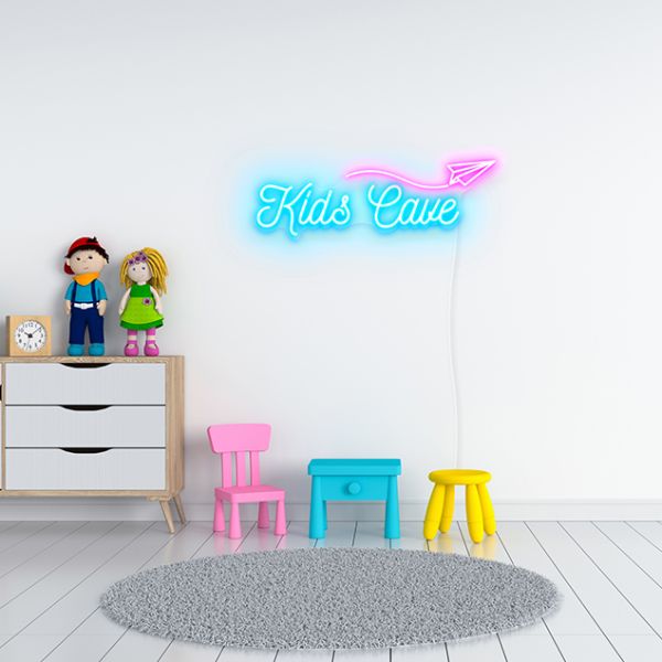 Kids Cave blue & pink light sign on white wall in a child's room by CUSTOM NEON®