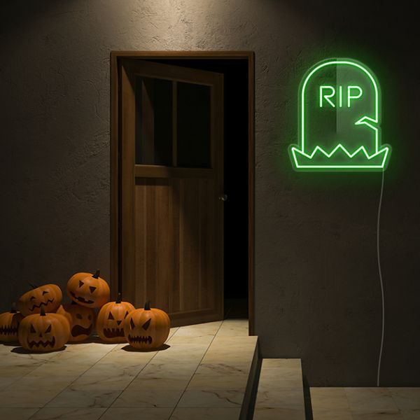 Yellow Light Up RIP Tombstone  on dark wall with spooky jack-o-lanterns - CUSTOM NEON® Halloween Decorations
