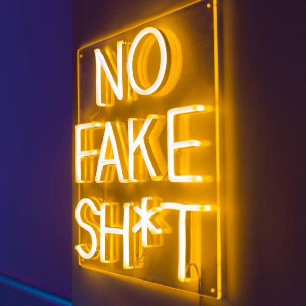 No Fake Shit LED neon sign shown wall mounted @customneon