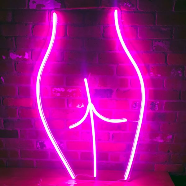 Artistic neon lamp / wall art featuring a minimalist nude.  - photo from CustomNeon.com
