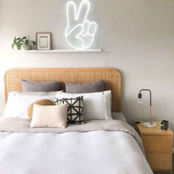 LED Neon Peace Emoji Sign Light shown on a shelf above a bed - Photo Custom Neon™