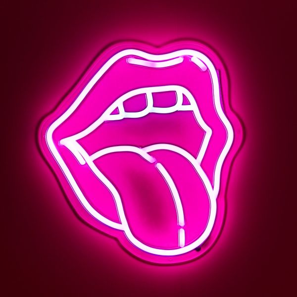 Custom Neon® pink tongue art shown illuminated against a dark pink wall