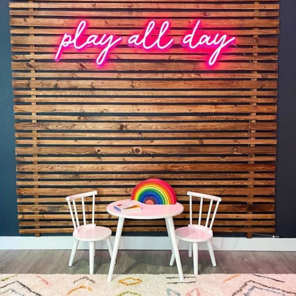 Play All Day faux neon sign in pink shown in a child's playroom - from Custom Neon®
