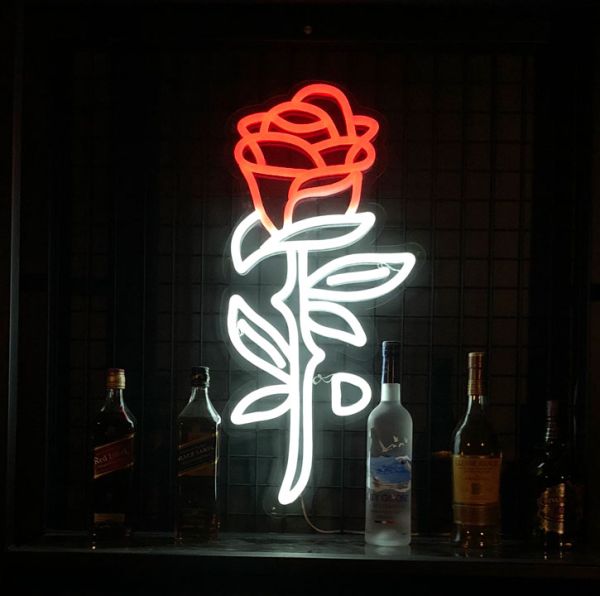 Rose Neon Sign Wall Art shown behind a bar - photo Custom Neon (formerly Neon Collective)