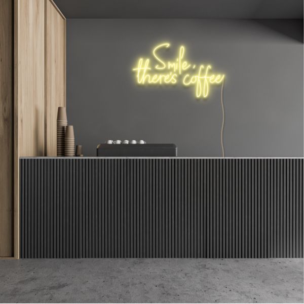 Smile, There's Coffee LED Neon Sign in warm white shown wall mounted in a cafe - from Custom Neon