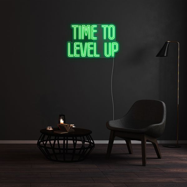 Time to Level up green LED neon sign shown against dark wall by Custom Neon®