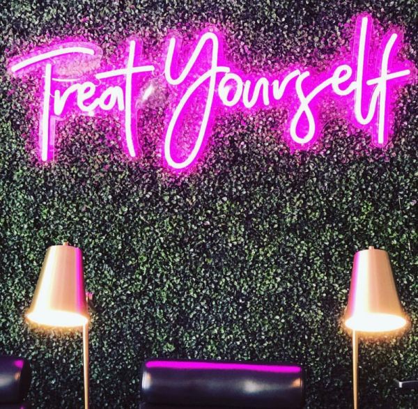 Treat Yourself faux neon sign on a green wall in a nail bar - from Custom Neon