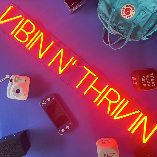 Vibin 'n Thrivin orange Custom Neon® sign