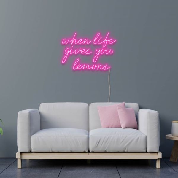 When Life Gives You Lemons pink neon flex sign wall mounted above a sofa - design by Custom Neon