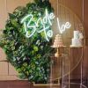 Gorgeous faux neon sign shown against a green background as wedding decor - photo from CustomNeon.com