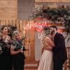 Crazy in Love LED neon wedding sign on a wooden/floral  background for wedding photo shoots - photo from Custom Neon (formerly Neon Collective)