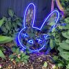 Custom Neon® blue bad bunny emoji LED art shown as lighted decor for an Easter egg hunt