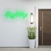 CUSTOM NEON® green Happy Holidays sign wall mounted near the front door of a house