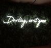 Darling, so it goes Neon Sign Quote for Weddings & Home Decor shown on green wall
 - photo from CustomNeon.co.uk