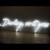 Darling, so it goes LED neon flex sign shown on a wooden table - photo from CustomNeon.co.uk