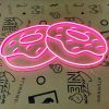 Pink donuts LED neon sign shown turned on - made by Custom Neon®