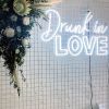 Drunk in LOVE LED neon sign shown on a mesh screen at a wedding - Custom Neon