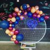 Blue LED neon heart with initials surrounded by balloons at an engagement party - from Custom Neon