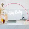 Hey Baby Light Up Sign shown with Baby Shower decorations - photo from Custom Neon by Neon Collective