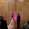 Holding hands in pink and red LED neon flex made by @customneon, styled for a wedding @thewarehousegeelong @theposieplace