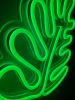 Monstera leaf neon light in dark green shown close up by Custom Neon®