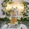 Mr & Mrs light sign behind he wedding cake - from Custom Neon