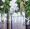 * Mr & Mrs * LED Neon Wedding Sign shown as part of the wedding decor. - Photo Custom Neon by Neon Collective