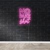 No Fake Shit pink LED neon sign against a black brick wall - by Custom Neon