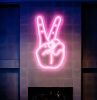 LED Neon Peace Sign Aesthetic Wall Art shown mounted on the wall over a fireplace - photo from Custom Neon by Neon Collective
