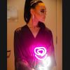 Handheld LED Neon Flower Bouquet held by a bride in her dressing room - photo from CustomNeon.com