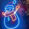 Custom Neon® snowman lightup decoration in front of a Christmas tree