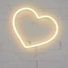 Small Neon Heart Light mounted on a brick wall from Custom Neon®