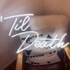 Til Death LED neon sign shown on a chair in a room - photo from CustomNeon.co.uk
