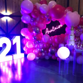 Custom Neon® personalized name sign in balloon arch at 21st birthday
