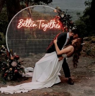 Better Together Custom Neon® wedding sign in outdoor woodland setting