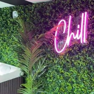 Custom Neon® pink CHILL waterproof sign in spa room designed by @zebra_interiors