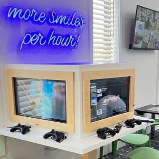 Custom Neon® More Smiles Per Hour sign in the childrens games room @chompersdental