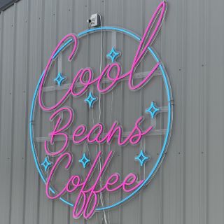 Pink & blue outdoor Custom Neon® sign on the exterior of the @coolbeanscoffee house